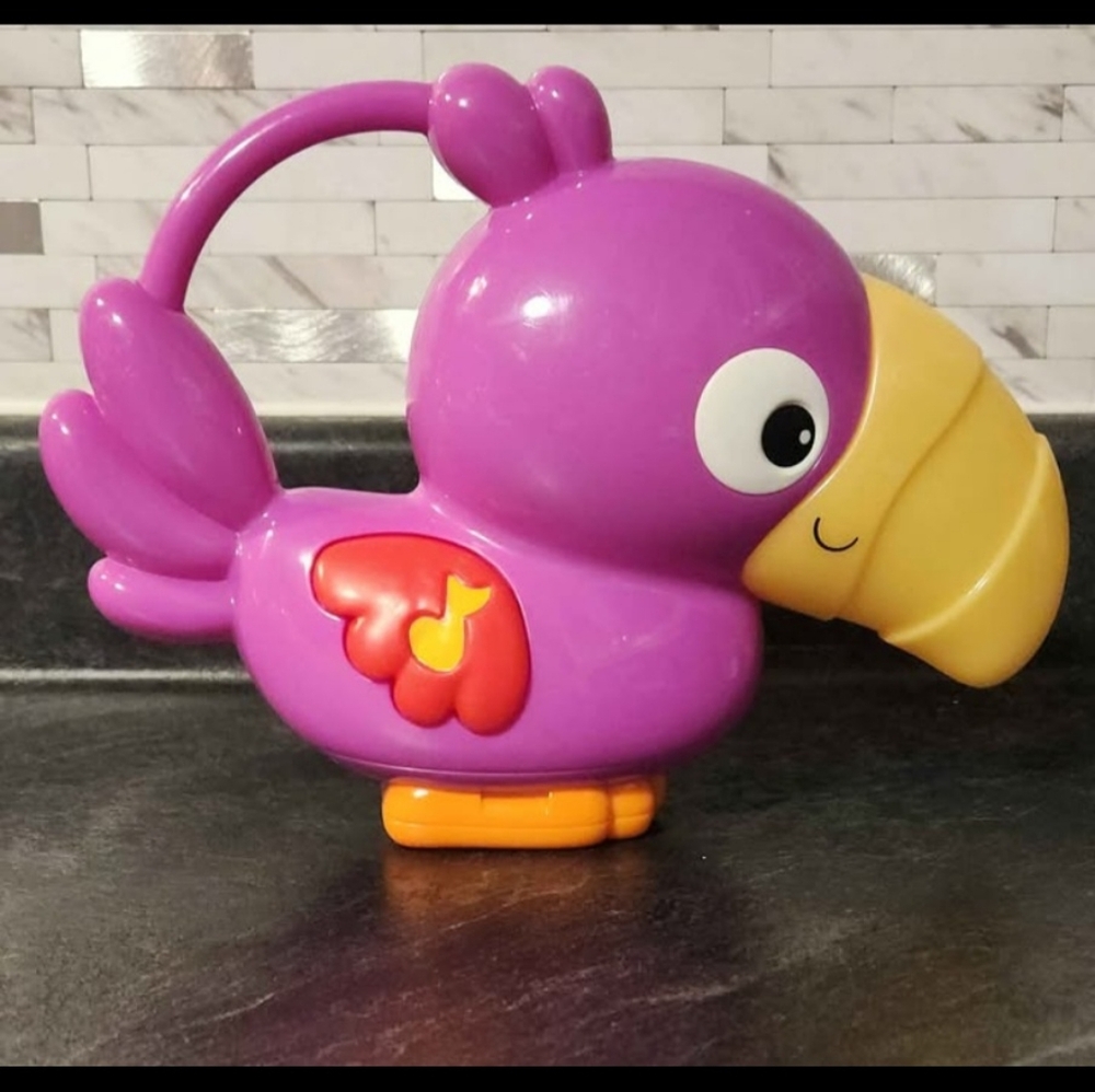 Vintage Fisher Price Rainforest Toucan Bird Lights and plays music -(Rare find)